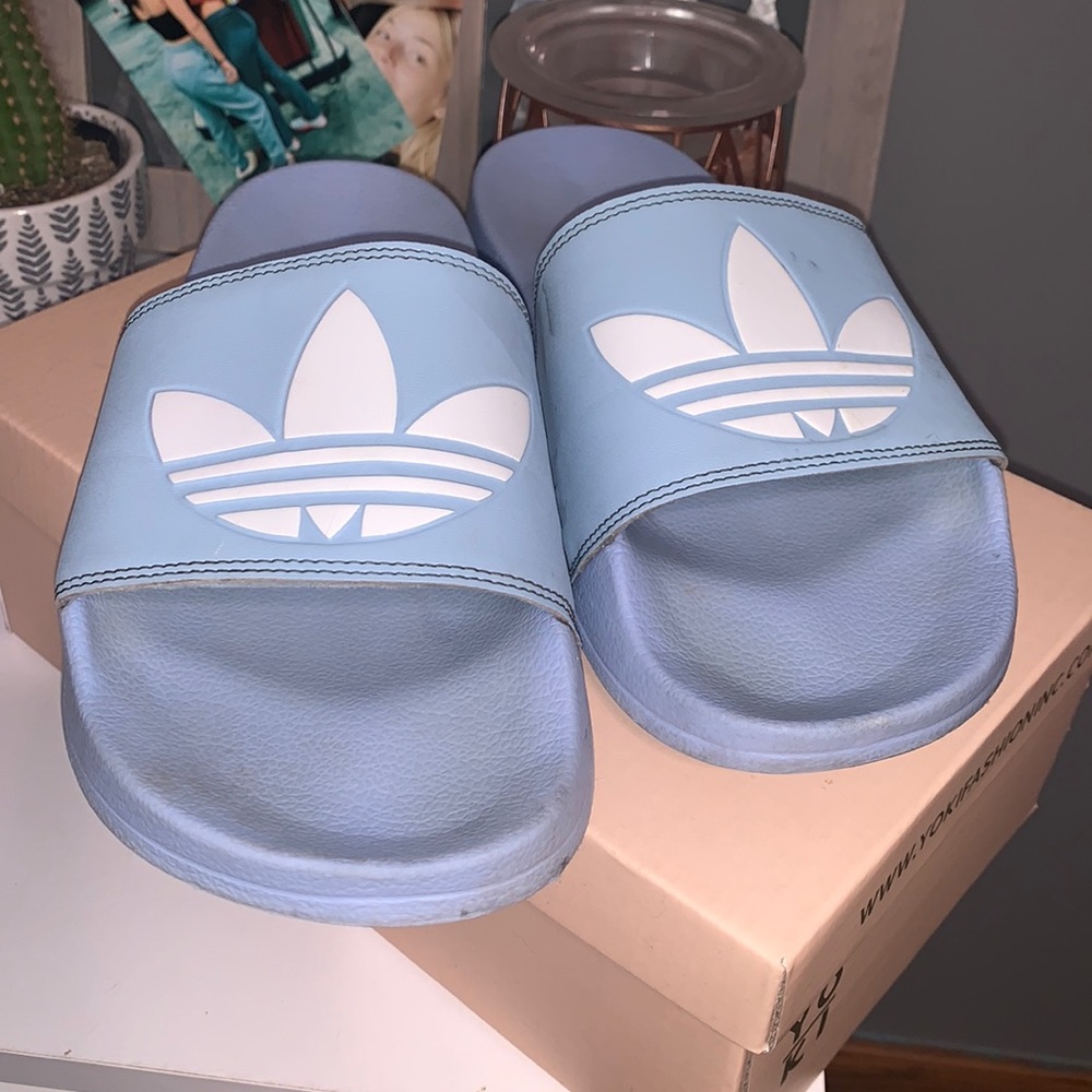 light blue Adidas slides
